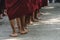 A line of monk in Burma seen by back