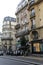 Line of motorcycles on sidewalk of busy street,downtown Paris,France,2016