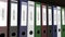 Line of multicolor office binders with Import and Export tags 3D rendering