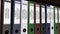 Line of multicolor office binders with Quarter and annual reports tags