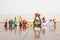 A line of old wooden christmas toys on an old wooden floor