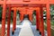 Line of orange torii gates at inari jinja of at Suwa Shrine in Nagasaki