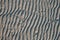 Line pattern on sand created by waves in Belitung Island beach, Indonesia