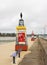 A line of small maritime markers along the pier at Morgat