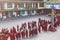 Line of Tibetan monks in front of Rumtek Monastery for welcoming high level monk near Gangtok. Sikkim, India.