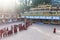 Line of Tibetan monks in front of Rumtek Monastery for welcoming high level monk near Gangtok. Sikkim, India.