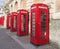 Line of typical old fashioned british red public telephone boxes outside the former post office in Blackpool Lancashire