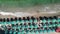 Lined beach umbrellas on a italian beach, downward view from drone