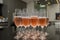 Lined crystal flutes filled with champagne on black granite counter for gold anniversary celebration. Toast of the 50 years of