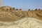 Lined up dramatically atop a rocky ridge, the Beehive Tombs