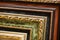 Lined up old wooden vintage art frames. Close-up fragment
