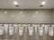 lined up well-maintained and clean urinals that are in the passenger arrival toilet at the airport