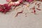 Linen cloth decorated with dried flowers and red petals of gerberas