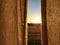 Linen curtains with beautiful sunset in wheat field.