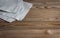 Linen gray kitchen napkin on a wooden table