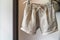 linen shorts on hanger, natural light, clean look