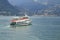 Liner, passenger liner, speedboat goes over Lake Como