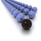 Lines of blue billiard balls and a black one