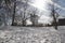 Lines of cloud on the sky and snow on the ground