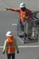 Linesmen Working Along a City Street During the Day