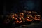 Lineup Of Flickering Jackolanterns Casting An Eerie Glow On Shadowy Background. Generative AI