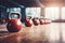 A lineup of kettles placed neatly on a wooden floor, fitness and weightlifting with kettlebell for workout, AI Generated