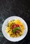 Linguine pasta with fresh tomato sauce, grated cheese and basil