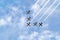 A link of five military jets in the sky