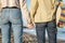 Linked hands of lesbian couple with rainbow colors