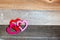 Linked Valentine`s hearts on weathered wood background