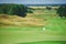 Links. Summer landscape overlooking the hills of the golf course.