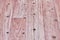 Linoleum flooring with nice embossed wood texture. Imitation wooden floor in pink color