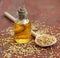 Linseed oil in bottle on wooden background