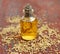 Linseed oil in bottle on wooden background