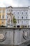 Linz, Austria, 27 August 2021: Baroque Neptunbrunnen fountain with sculptures of dolphins, Hauptplatz or main square at sunny