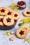 Linzer Christmas cookies with stars. Delicious biscuits with raspberry jam.