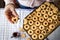 Linzer cookie in hand. Baked traditional Christmas pastry