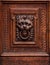 Lion Head as Wood Carving in Old Door