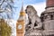 Lion looking at Big Ben clock, London, UK