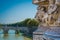 Lion`s face present at the base of the sculptures of the Vittorio Emanuele II bridge in Rome, Italy