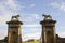 Lion sculptures on top of a stone gate posts at the Bishop`s Gate entrance to Mussenden on the north coast of Northern Ireland