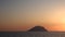 Lipari Island in Mediterranean sea against horizon, clear colorful sky. Summer sunrise. Sicily, Italy
