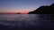 Lipari Islands in Mediterranean sea, horizon. Sailing yachts and boats in distance. Colorful sky, sunset or sunrise