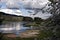 Lipno water reservoir with blossom, sandy beach and nice sky