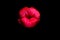 Lips kiss isolated on black. Close up of womans pouting lips with red lipstick. Beautiful red lip. Love and kissing