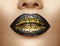 Lips makeup. Beauty high fashion gradient lips makeup sample, black with golden color. mouth. Lipstick