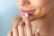 Lips Protection. Closeup of Healthy Woman Lips And Smooth Skin