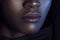 Lips of young beautiful black woman with clean perfect skin