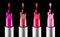 Lipstick colourful tints palette. Fashion Colorful liquid Lipsticks dripping, isolated on black background, Professional Makeup