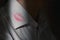 Lipstick marks on the collar of a men`s white shirt